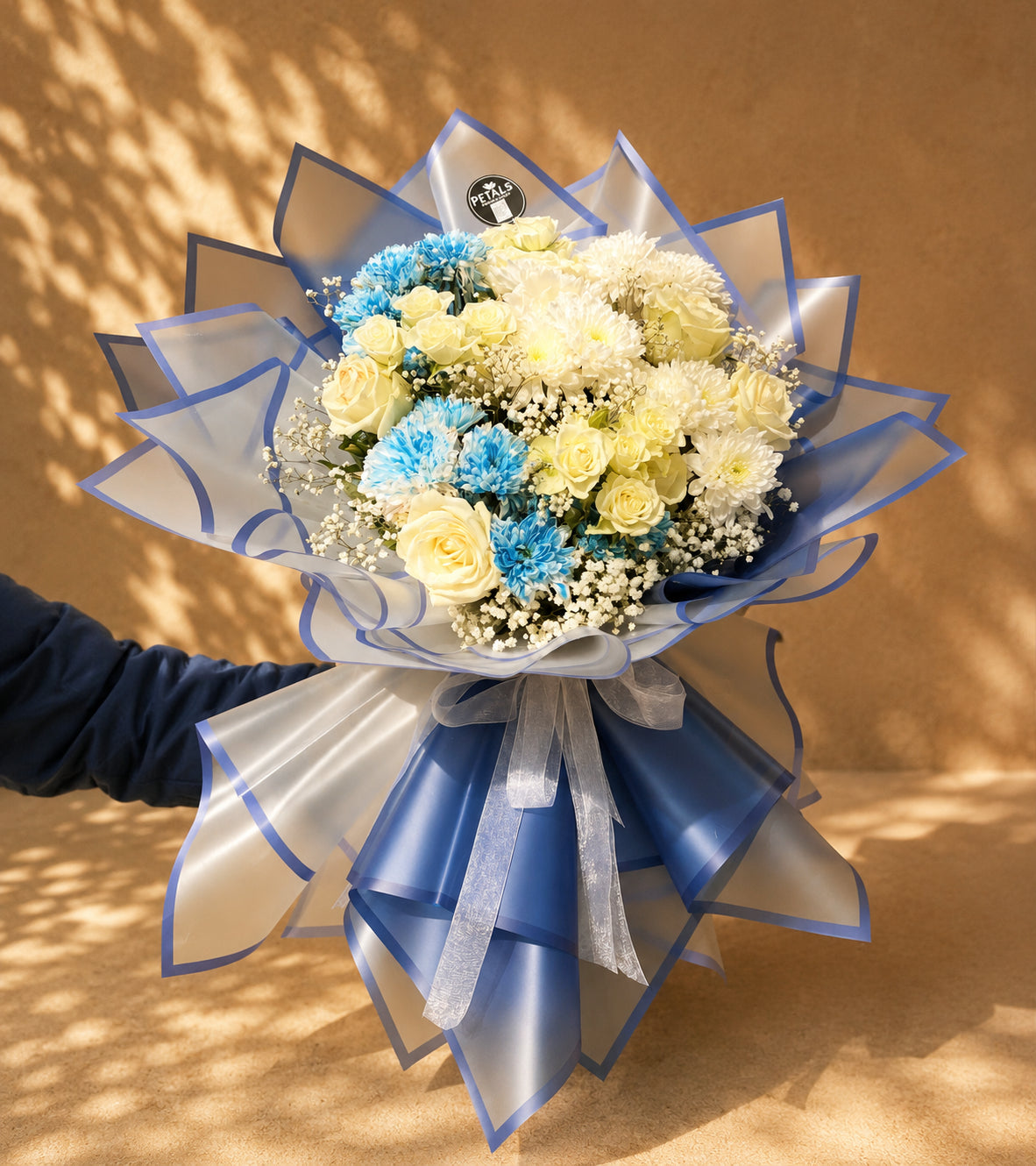 Blue Moon blue and white flower bouquet by Petals in Lahore