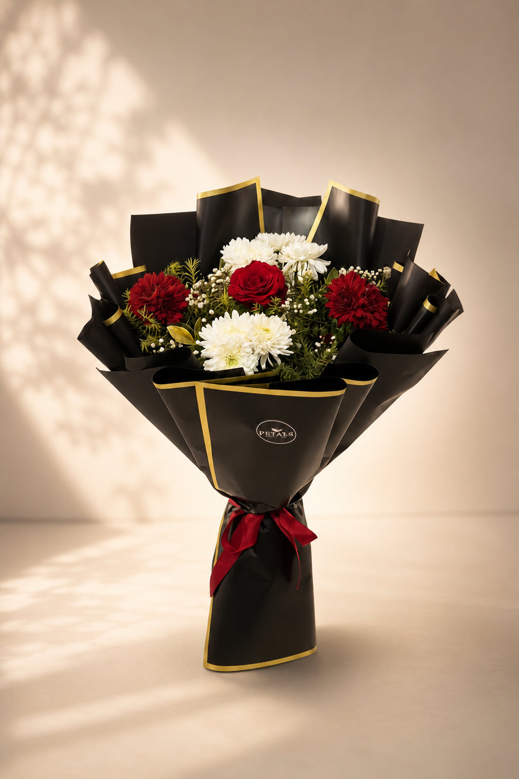 Cheerful Burst red and white mixed flower bouquet by Petals in Lahore
