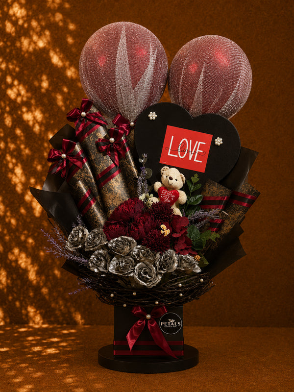 Dark Love Bloom romantic balloon teddy and flower gift arrangement by Petals in Lahore