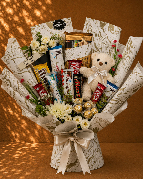 Garden of Eaten chocolate and flower gift tray by Petals in Lahore