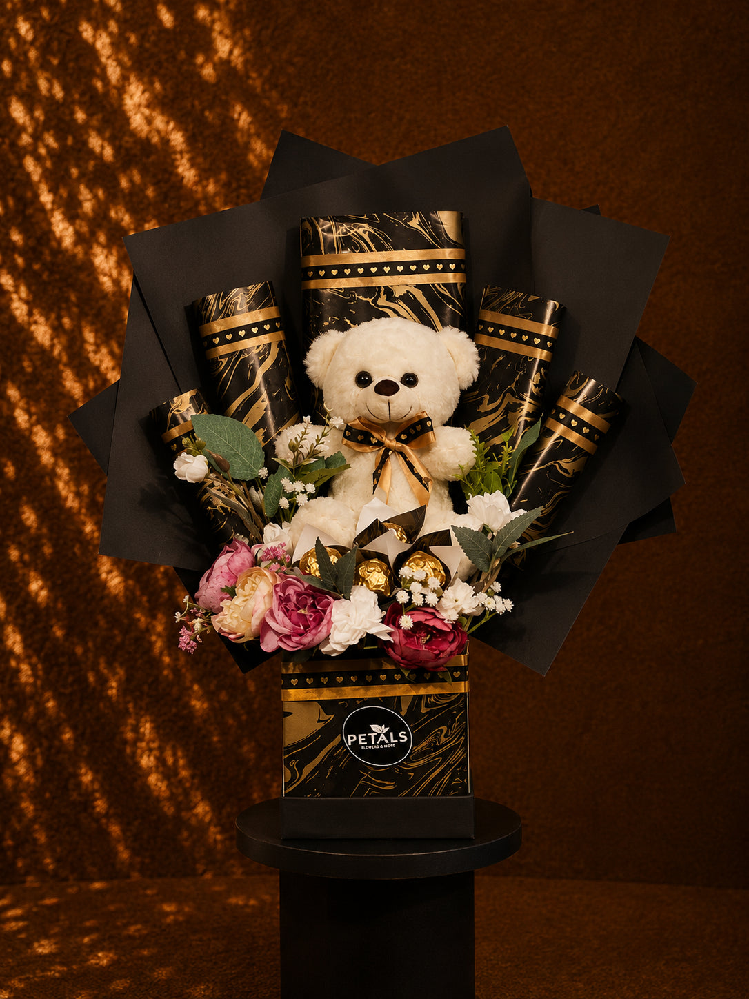 Golden Universe teddy chocolate and flower gift arrangement by Petals in Lahore